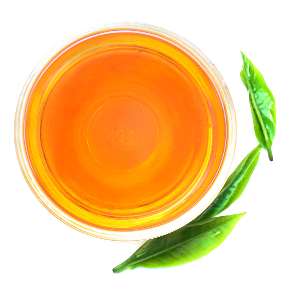 Walters Bay Chai Tea brewed in a cup with two tea leaves